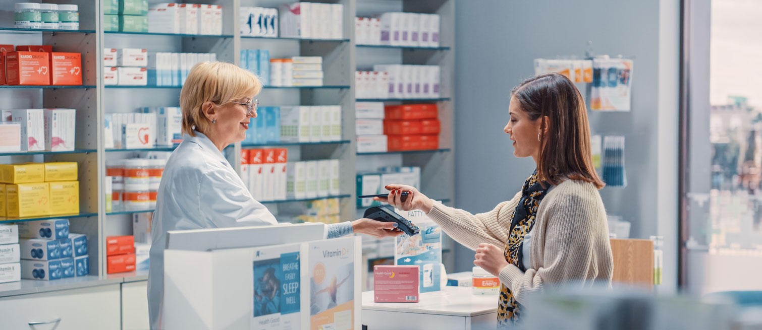 Pharmacist selling a prescription to a patient