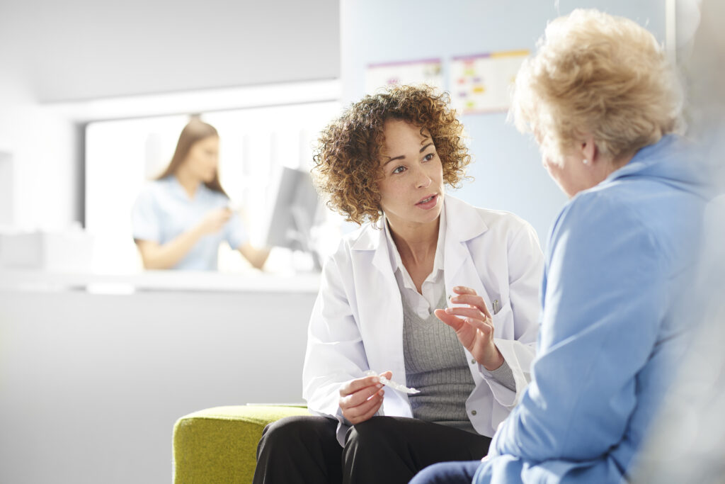 A pharmacist consulting a patient.